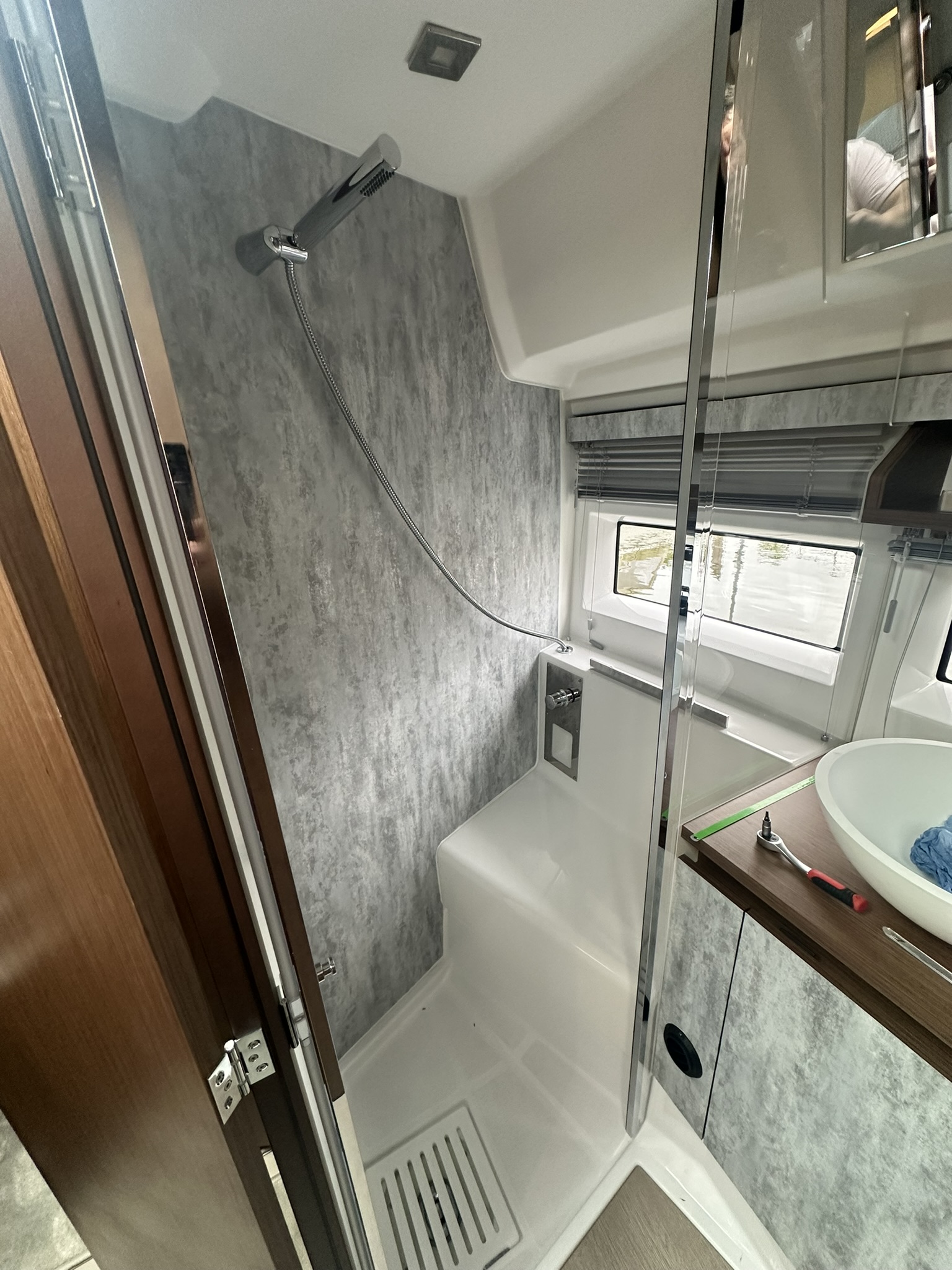 Yacht shower area afterwards - modern shower area with wood accents and minimalist design